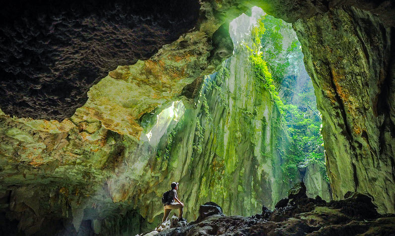 Hiker in cave in Sarawak
